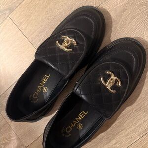 CHANEL Quilted Black Loafers with Gold Emblem